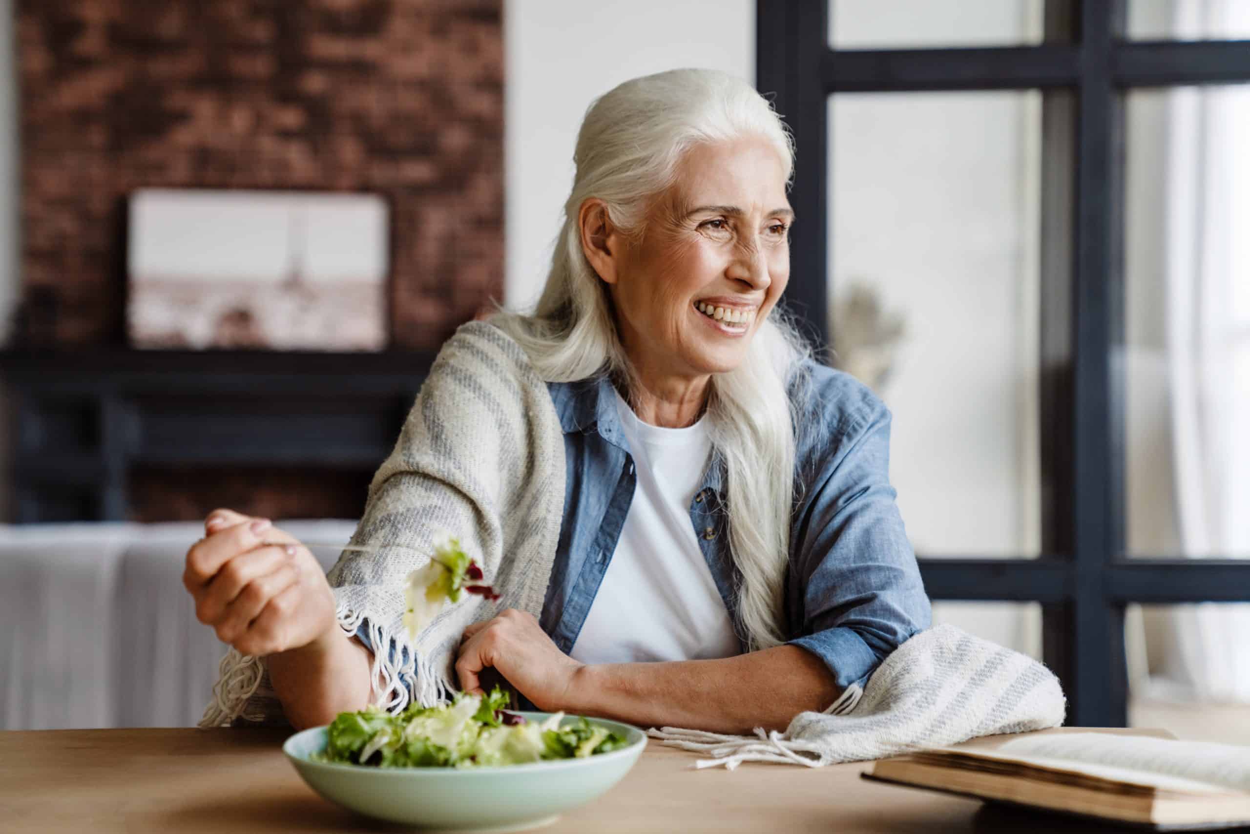 Healthy woman over 40 enjoying a nutritious meal